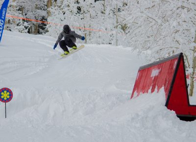 Spencer Dallas 2nd place 17 & under mens snow Flying off the jump. Photo CJ Anderson