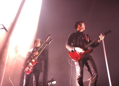 Queens of the Stone Age guitarists Troy Van Leeuwen and Dean Fertita cover left-stage with a sweet double neck and great lighting. Photo: Lmsorenson.net