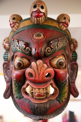 The wooden mahalaka masks available at Himalayan Arts speak to Owner Yeshi Shekhand's Tibetan heritage (2/3).