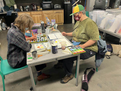 (L–R) Artists Chrysallis and Claire collaborate at Art Access.