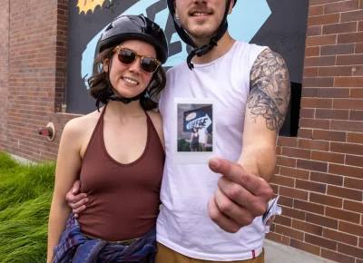 (L-R) Megan and Kent earn an extra point by posing for an INSTAX photo in from of the Midway Coffee sign. Photo: TaCara DeTevis.