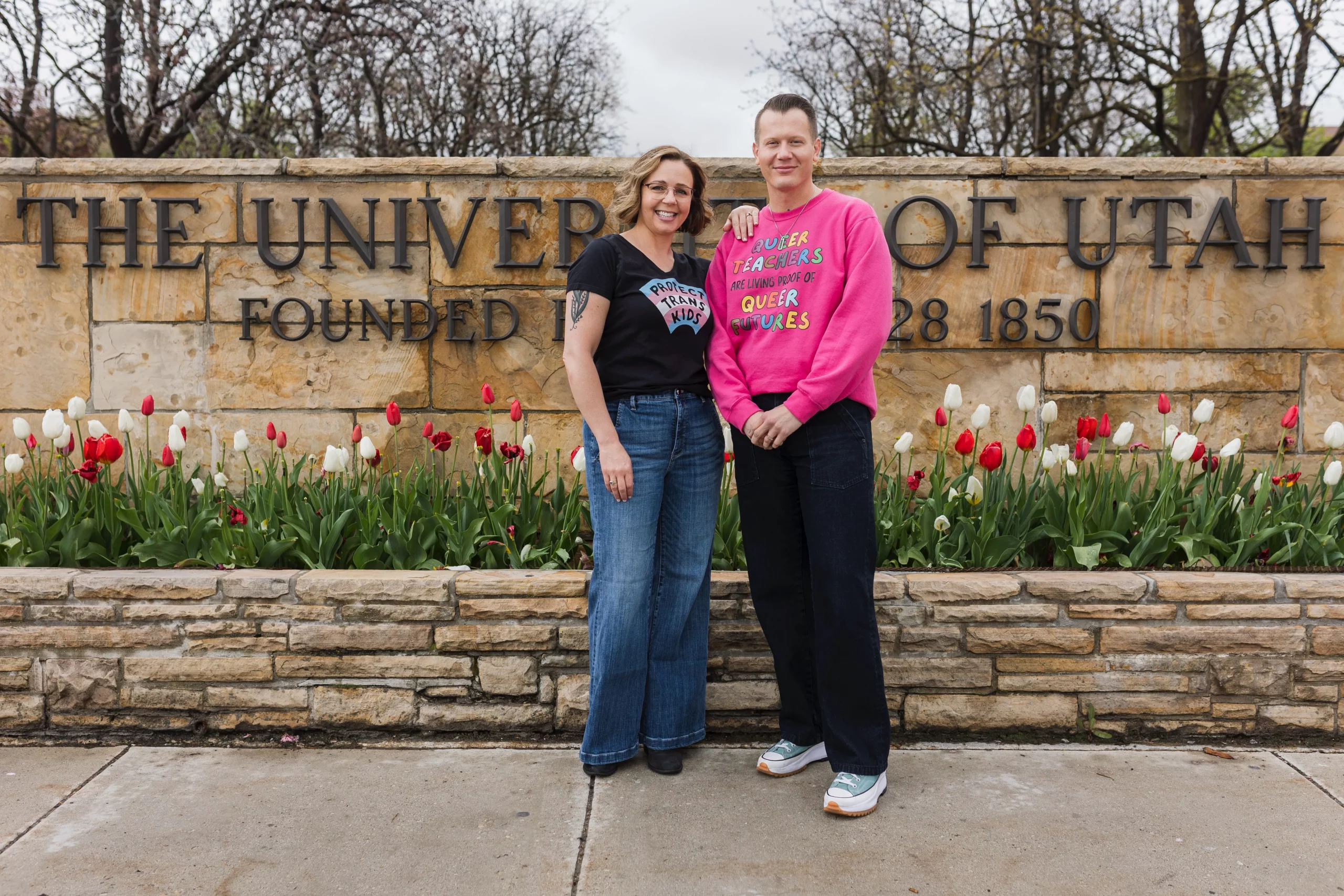 F.A.M. co-founders Dr. Alli Martin and Dr. Kody Colvin stand in front of a sign that reads, "University of Utah".