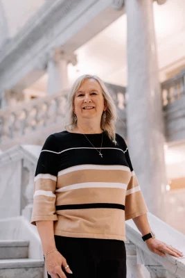 A photo of Sue Robbins at the capital. 