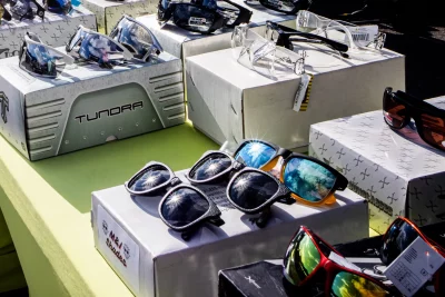 A table displaying multiple fashionable sunglasses.