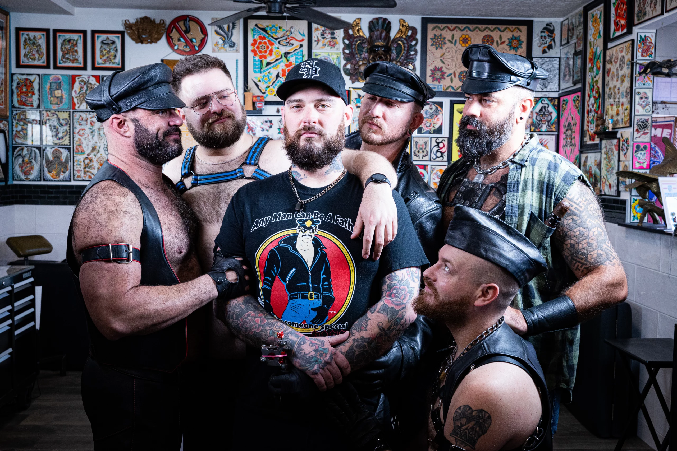 Tattoo artist Cory Harris surrounded by bears.