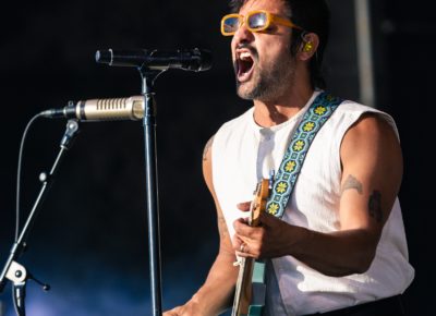Sameer Gadhia of Young the Giant singing on stage in Salt Lake City in front of a huge crowd. Photo: @lmsorenson