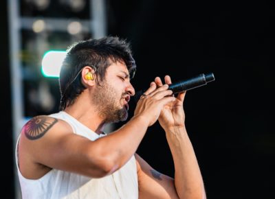 Sameer Gadhia of Young the Giant on stage singing in Salt Lake City. Photo: @lmsorenson