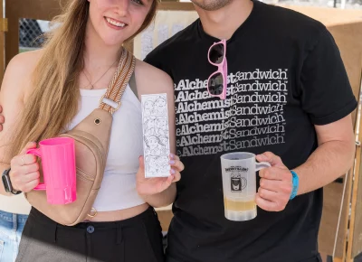Bryce and Mirjabella smile with their hand drawn photo booth pictures. Photo: Chay Mosqueda.