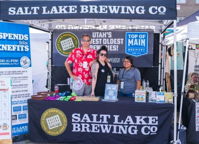 From left to right, Rick, Mel and Liz from SLC Brewing Co served cold ones with a big smile. Photo: Chay Mosqueda.