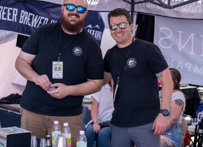 Connor Kelly and Tyler Halstead show off Outlaw Distillery's impressive lineup of whiskey. Photo: Brayden Salisbury.