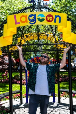 Alton Barnhart poses with the Lagoon entrance sign. 