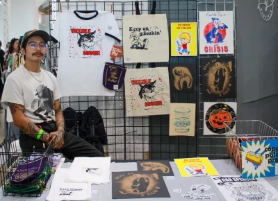 Jacob Lara proudly displays his screen-printed work. Photo: Hayley Stoddard.