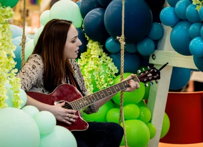 Live Rylan performs among balloon displays. Photo: Derek Brad.