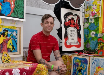 Robin Banks poses with their art at DIY Fest. Photo: Jovvany Villalobos.