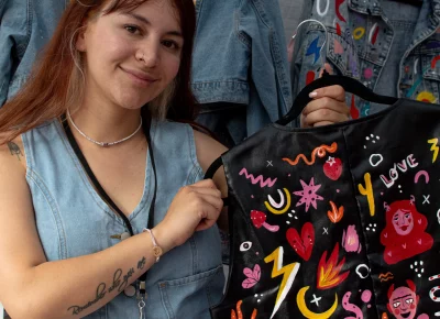 By Lau shows off a handpainted vest. Photo: Jovvany Villalobos.