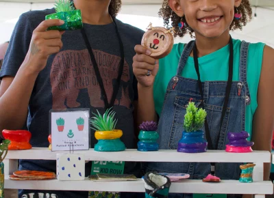 Nia's Clay Charms are a hit at Kid Row. Photo: Jovvany Villalobos.