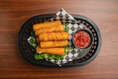 A basket of mozzarella sticks with a side of marinara sauce