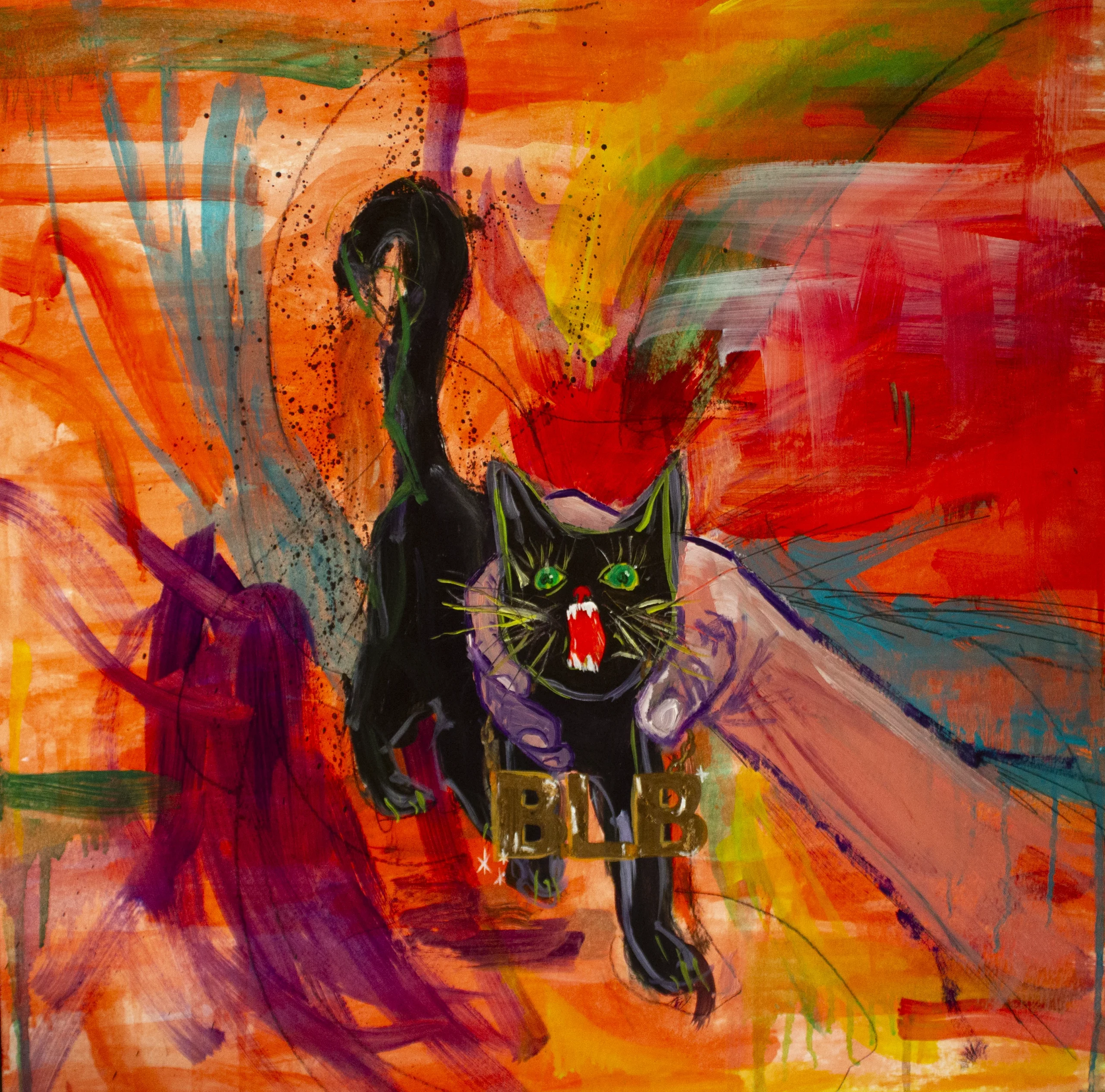 A splatter of multicolored paints with a black cat being squeezed by a hand coming from the corner of the image.