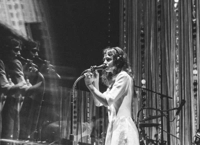 Dressed in a retro white dress and surrounded by a shimmering curtain, the set matched Clairo's music perfectly.