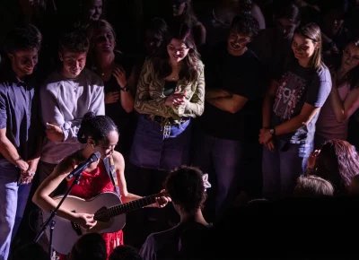 Griff gets literally immersed in the audience for her acoustic set. Photo: Derek Brad.