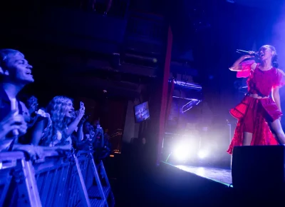 Griff engages the audience from behind the barricade. Photo: Derek Brad.