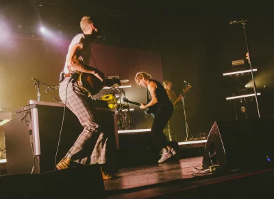 Band members of Judah and the Lion play.