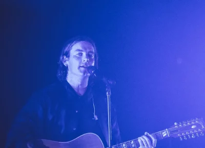 Judah Aker sings and plays his guitar at the Judah and the Lion concert.