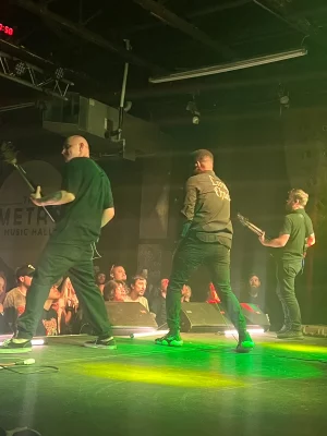 Oceano performs under green lighting on stage at Metro Music Hall. 