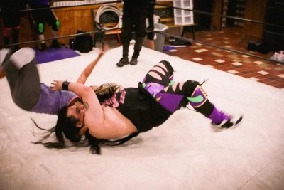 Princess Deathwish executes a suplex. 