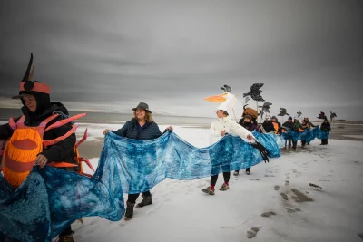 nan seymour participates in a parade at Antelope Island, featuring puppets representing the creatures of the Great Salt Lake. Photo courtesy of Anna Pocaro Photography