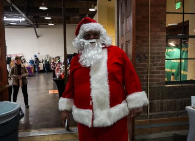 Even Santa needs to step away for some shopping. Photo: Dominic Jordon.