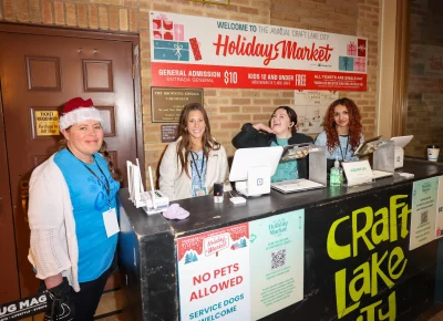 The folks working Holiday Market are all smiles. Photo: John Barkiple.