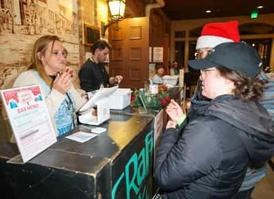 Holiday Market cashiers are happy to assist. Photo: John Barkiple.