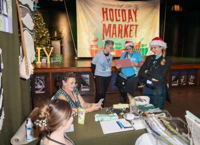 Angela H. Brown smiles for a job well done at Holiday Market. Photo: John Barkiple.