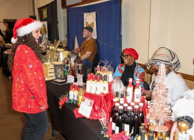 Craft Lake City's Tiana Young smiles at the great display of local sauces. Photo: John Barkiple.