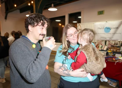 Ashley Osborne brings sweet baby Juniper and husband Jo along to the market. Photo: John Barkiple.